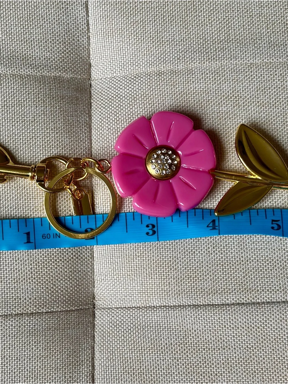 Stylish Pink Flower Keychain with Gold-Tone Stem
